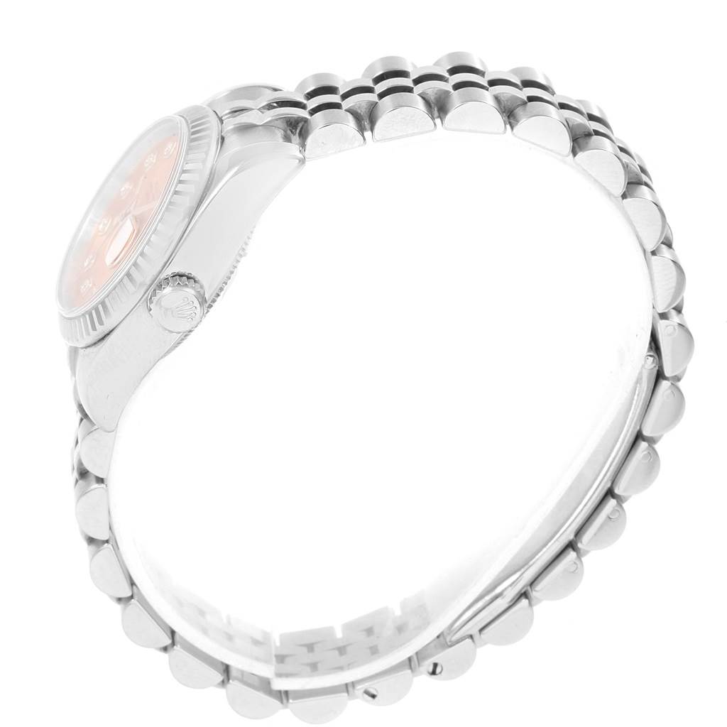 The image shows the side profile and bracelet of the Rolex Datejust 179174 Women
s Stainless Steel Pink Dial 179174 Women
s Stainless Steel Pink Dial watch, highlighting its crown and bezel.