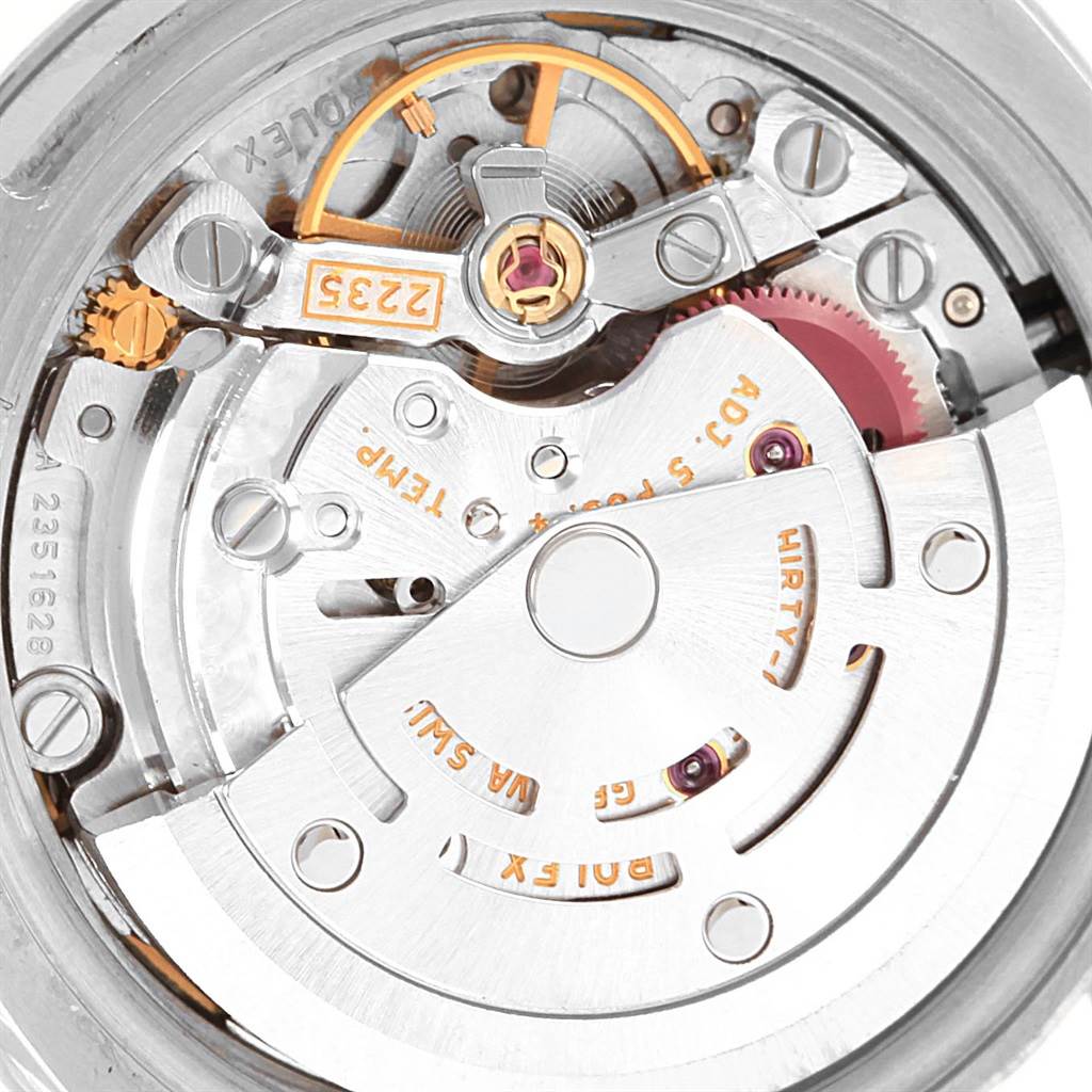 The image shows the internal mechanical parts of the movement in a Rolex Datejust 179174 Women
s Stainless Steel Pink Dial 179174 Women
s Stainless Steel Pink Dial watch from a close-up angle.