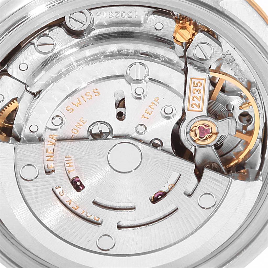 This image shows a close-up view of the internal mechanical movement of a Rolex Datejust 79163 Women's Steel and Gold (two tone) Black Dial 79163 Women's Steel and Gold (two tone) Black Dial watch.