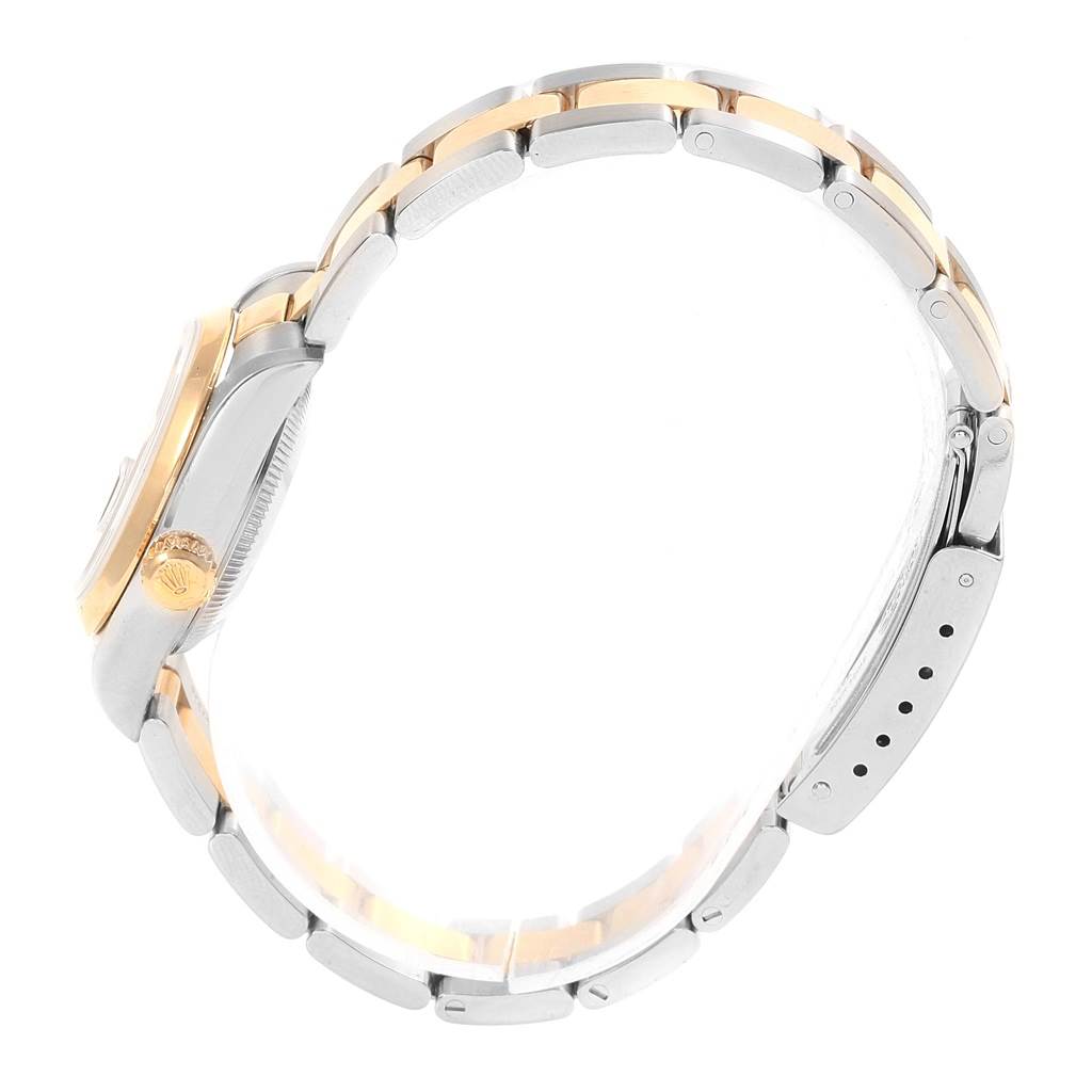 This is a side view of a Rolex Datejust 79163 Women's Steel and Gold (two tone) Black Dial 79163 Women's Steel and Gold (two tone) Black Dial model, showing the crown, case, and two-tone bracelet.