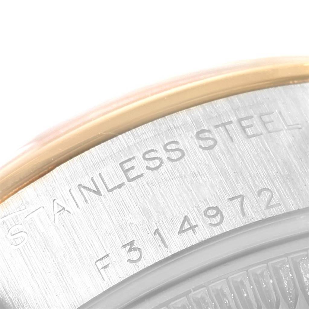 This image shows a close-up of the engraved stainless steel casing of a Rolex Datejust 79163 Women's Steel and Gold (two tone) Black Dial 79163 Women's Steel and Gold (two tone) Black Dial watch.