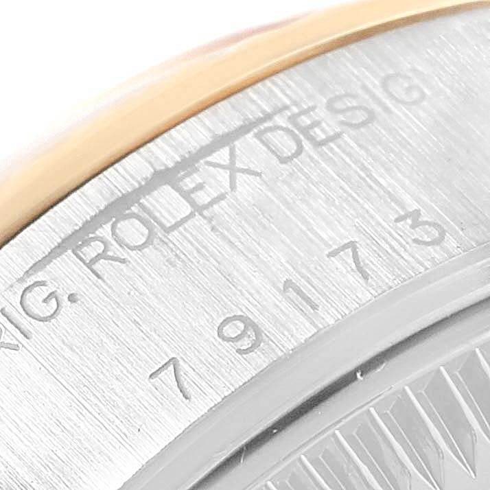 This image shows a close-up view of the reference numbers and the Rolex engraving on a Datejust model by Rolex.