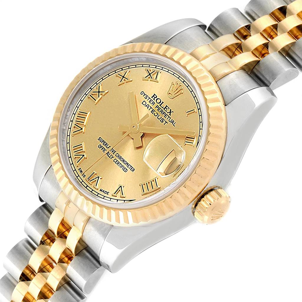 The image shows a close-up of a Rolex Datejust 179173 Women's Steel and Gold (two tone) Champagne Dial 179173 Women's Steel and Gold (two tone) Champagne Dial watch, highlighting its gold dial, fluted bezel, crown, and Jubilee two-tone bracelet.