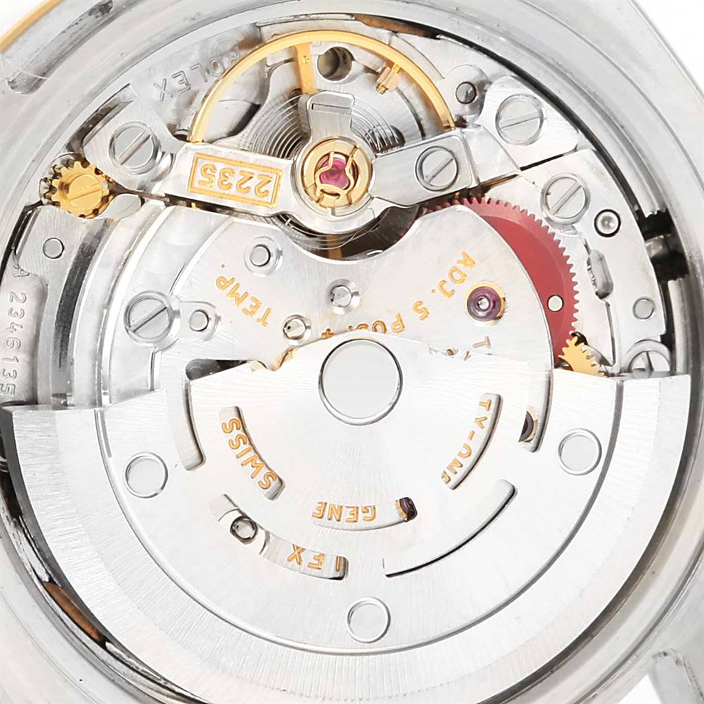 This image shows the intricate internal mechanism and movement of a Rolex Datejust 179173 Women's Steel and Gold (two tone) Champagne Dial 179173 Women's Steel and Gold (two tone) Champagne Dial watch from a close-up angle.