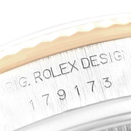 The image shows a close-up of the case edge and serial number of a Rolex Datejust 179173 Women's Steel and Gold (two tone) Champagne Dial 179173 Women's Steel and Gold (two tone) Champagne Dial watch.