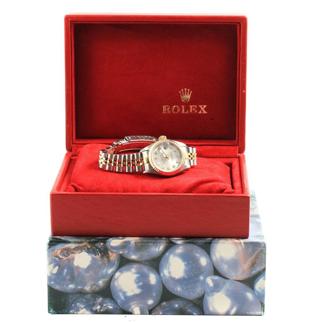 The Rolex Datejust 79173 Women's Stainless Steel Silver Dial 79173 Women's Stainless Steel Silver Dial watch is displayed in its open box, showing the face, bezel, and bracelet.