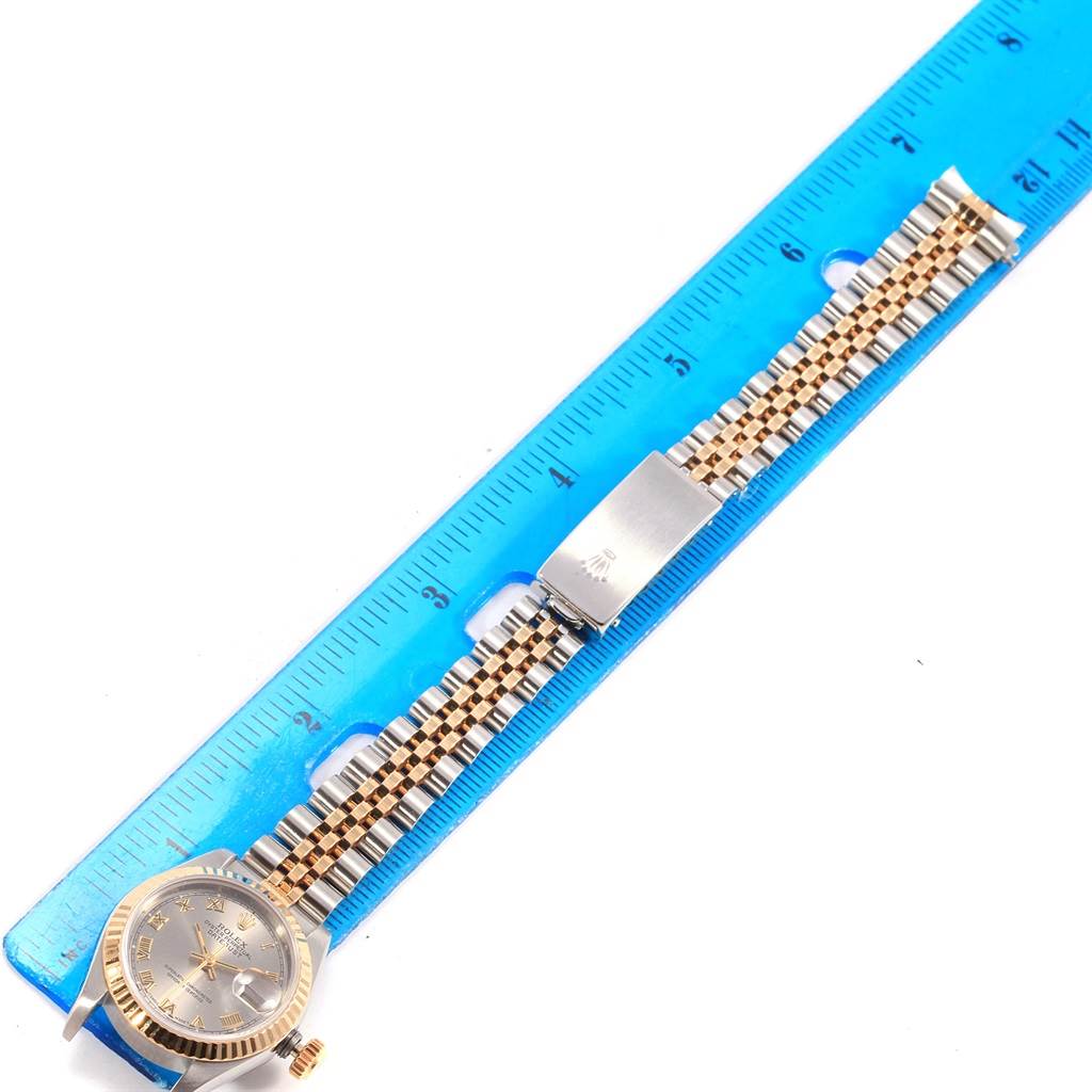 This image shows a Rolex Datejust 69173 Women's Stainless Steel Grey Dial 69173 Women's Stainless Steel Grey Dial watch laid flat next to a ruler, displaying the face, bracelet, and clasp.