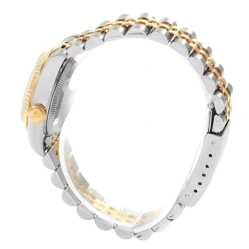 This side-angle view of the Rolex Datejust 69173 Women's Stainless Steel Grey Dial 69173 Women's Stainless Steel Grey Dial watch shows the bracelet and case, highlighting the two-tone design and crown.