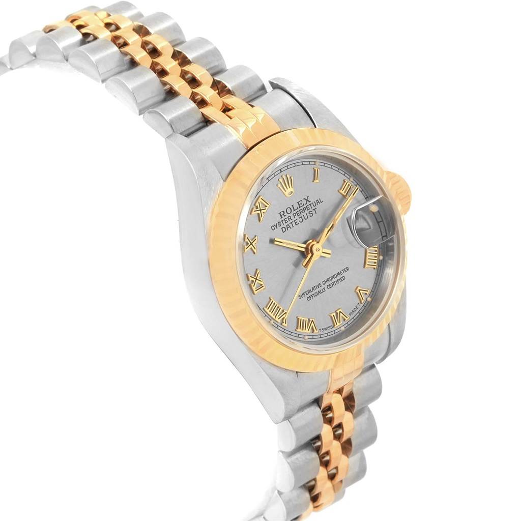 The image shows a Rolex Datejust 69173 Women's Stainless Steel Grey Dial 69173 Women's Stainless Steel Grey Dial watch from an angled top view, highlighting its two-tone bracelet, gold bezel, and silver dial with Roman numerals.
