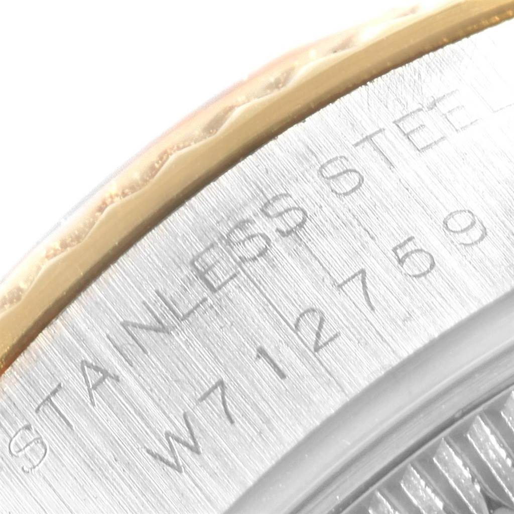 This image shows a close-up of the "stainless steel" engraving on the back case of a Rolex Datejust 69173 Women's Stainless Steel Grey Dial 69173 Women's Stainless Steel Grey Dial watch.