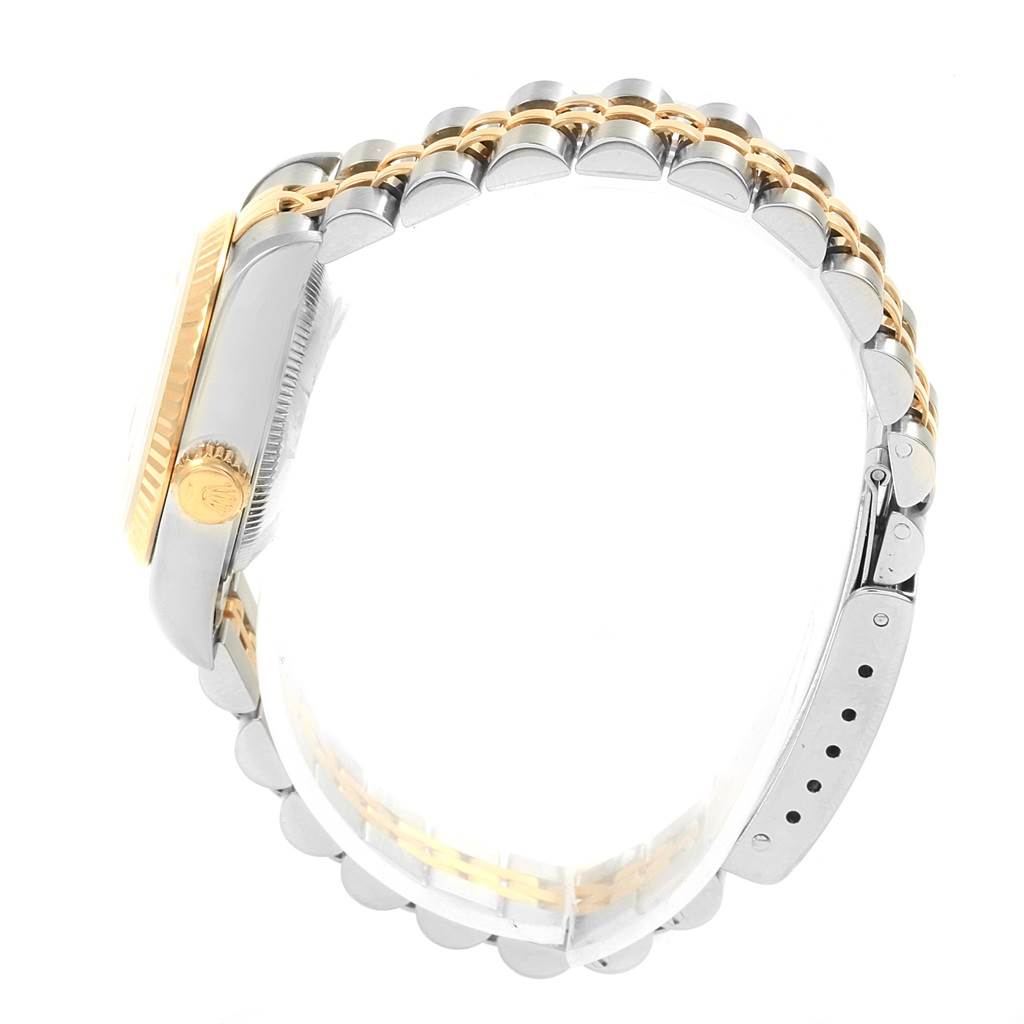 The side view shows the bracelet, clasp, crown, and bezel of the Rolex Datejust 69173 Women's Steel and Gold (two tone) Blue Dial 69173 Women's Steel and Gold (two tone) Blue Dial watch.