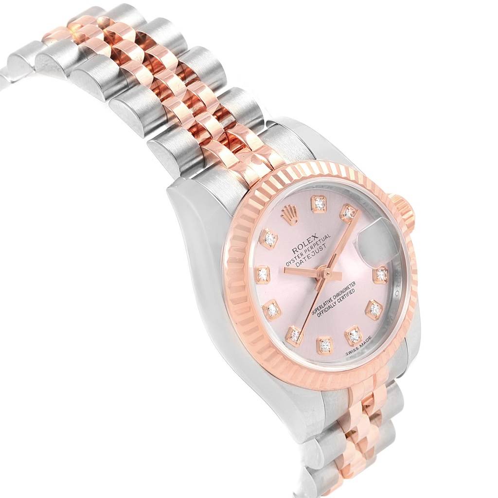 This image shows a side angle of a Rolex Datejust 179171 Women
s Steel and Gold (two tone) Pink Dial 179171 Women
s Steel and Gold (two tone) Pink Dial watch, highlighting its bracelet and pink dial with diamond markers.