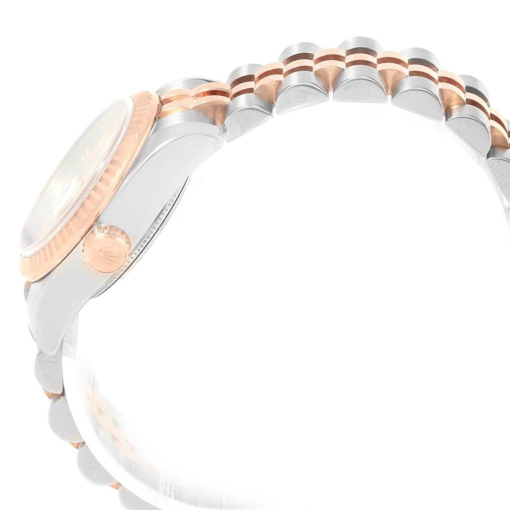 The image shows a side view of a Rolex Datejust 179171 Women
s Steel and Gold (two tone) Pink Dial 179171 Women
s Steel and Gold (two tone) Pink Dial watch focusing on the crown, case, and part of the bracelet.