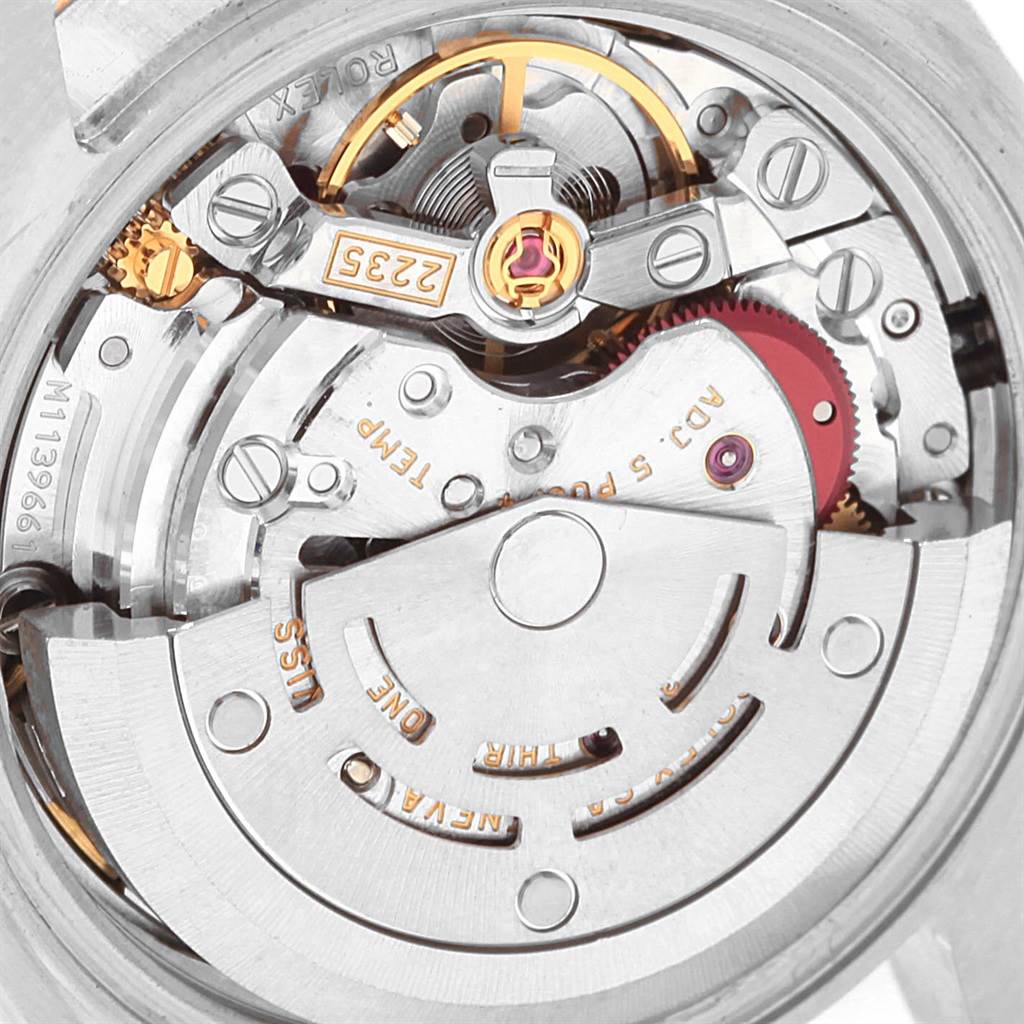 This image shows a close-up of the Rolex Datejust 179171 Women
s Steel and Gold (two tone) Pink Dial 179171 Women
s Steel and Gold (two tone) Pink Dial movement, showcasing its intricate internal components.