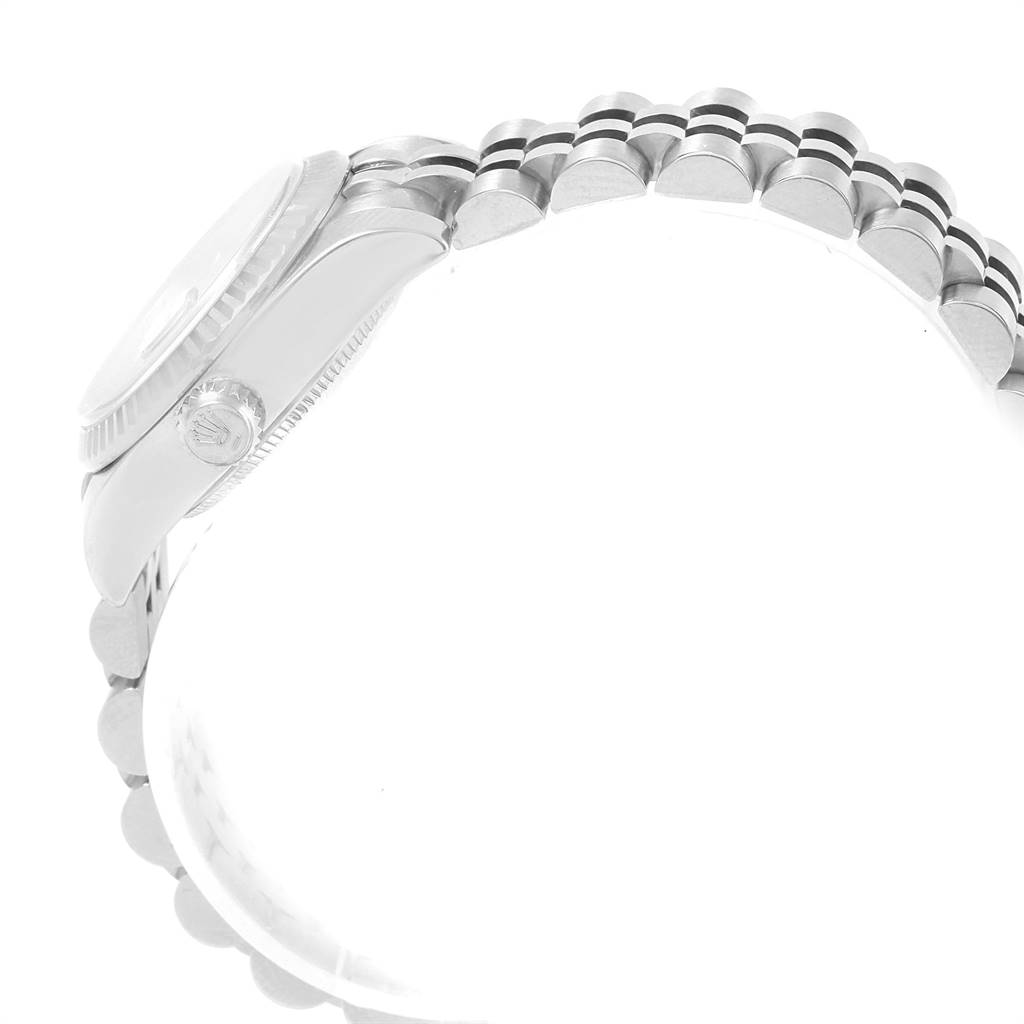 The image shows a side view of the Rolex Datejust 179174 Women's Steel and Gold (two tone) Silver Dial 179174 Women's Steel and Gold (two tone) Silver Dial watch, focusing on the case, crown, and part of the bracelet.