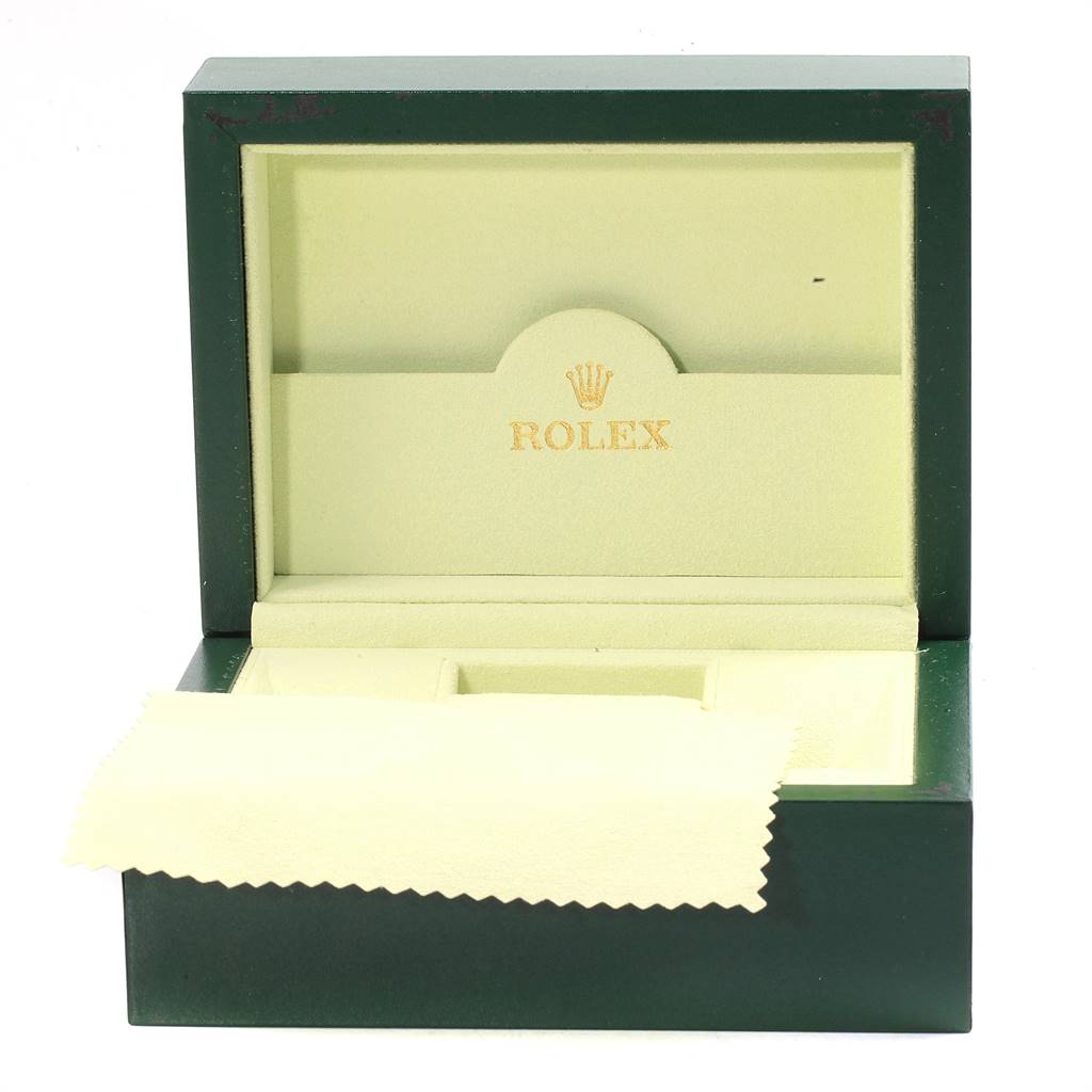 The image shows an open Rolex box for a Datejust model, including a cleaning cloth and interior compartments.