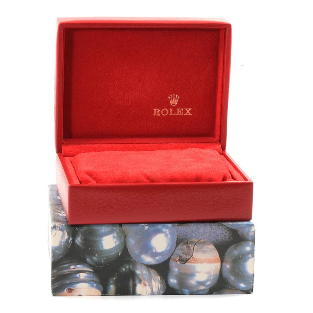 The image shows an open Rolex Datejust 69173 Women's Stainless Steel Black Dial 69173 Women's Stainless Steel Black Dial watch box with a red cushion inside.