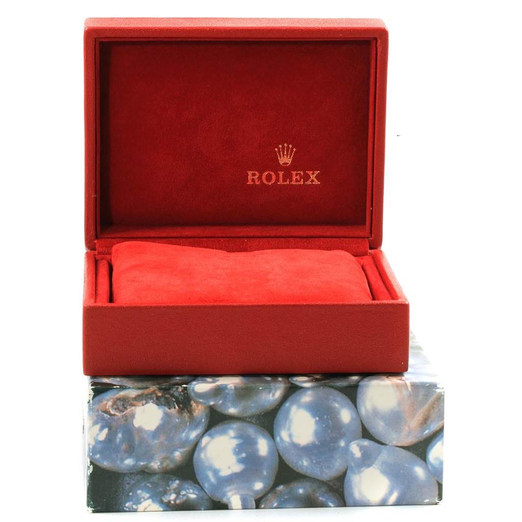 This image shows a red Rolex watch box for the Datejust model, with the pillow and the inner lining visible.