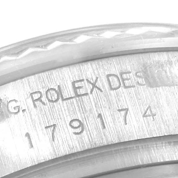 The image shows a close-up angle of the caseback engraving on a Rolex Datejust 179174 Women
s Stainless Steel Silver Dial 179174 Women
s Stainless Steel Silver Dial watch.