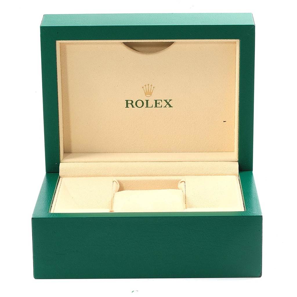 This image shows an open green and beige Rolex watch box for a Datejust model.
