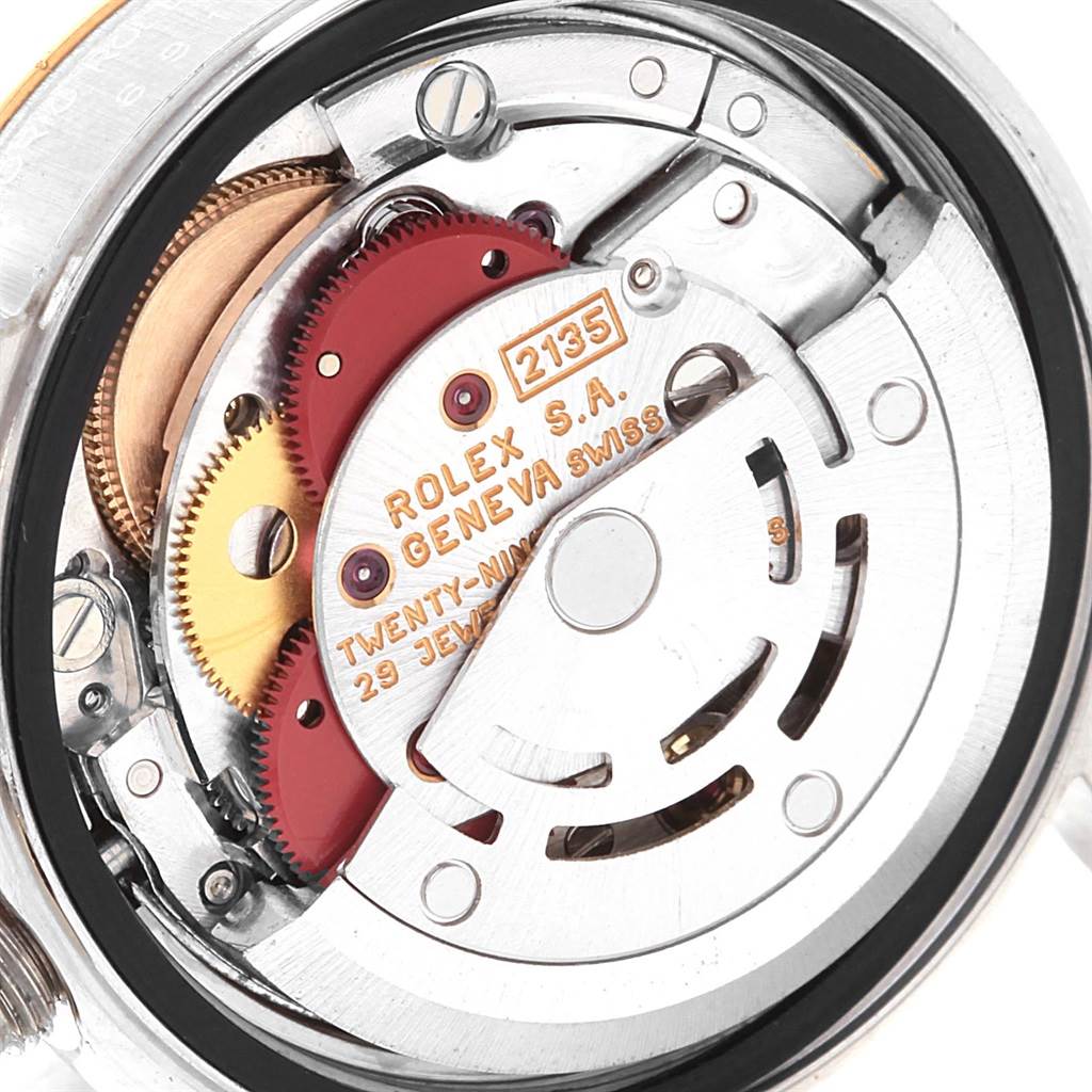 This image shows the internal movement of a Rolex Datejust 69173 Women's Stainless Steel Beige Dial 69173 Women's Stainless Steel Beige Dial watch, displaying gears and the automatic rotor.