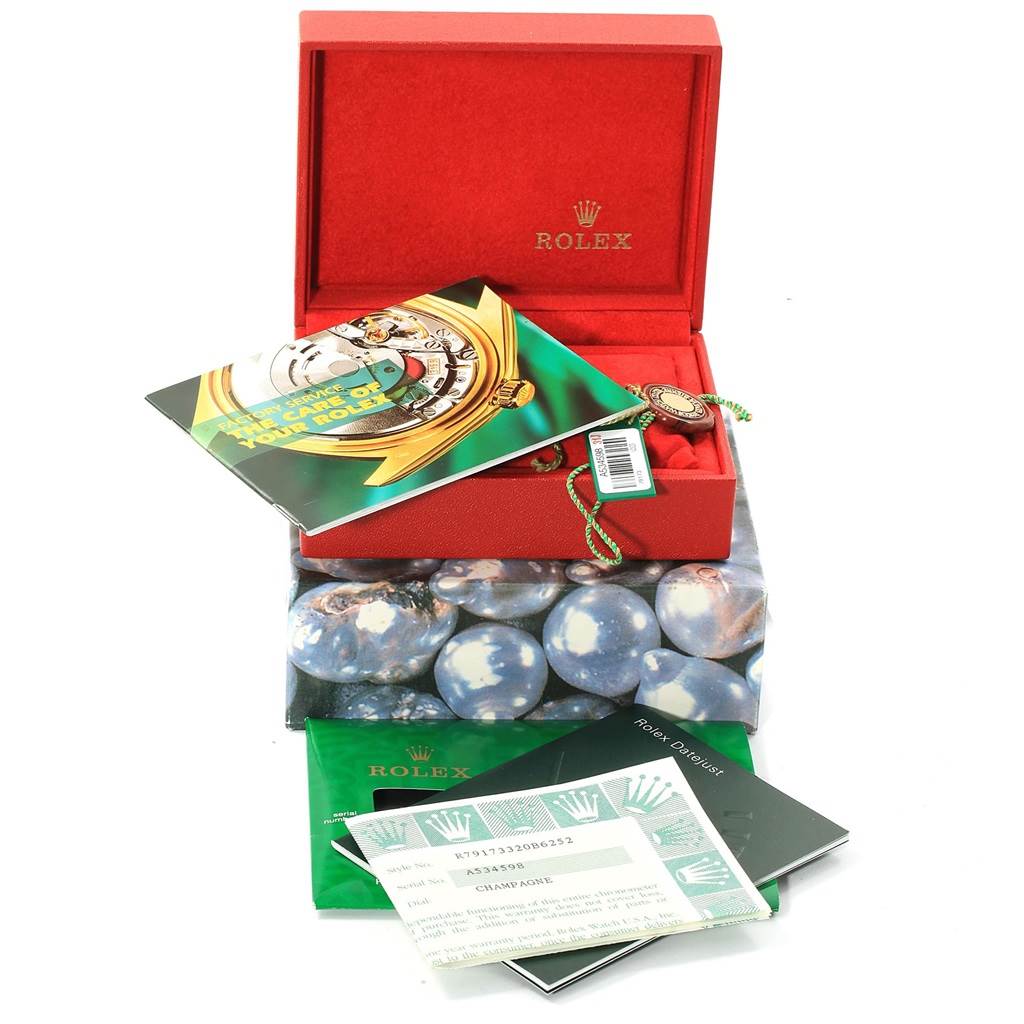 The image shows the packaging, booklets, and certification for the Rolex Datejust 79173 Women's Steel and Gold (two tone) Champagne Dial 79173 Women's Steel and Gold (two tone) Champagne Dial watch.