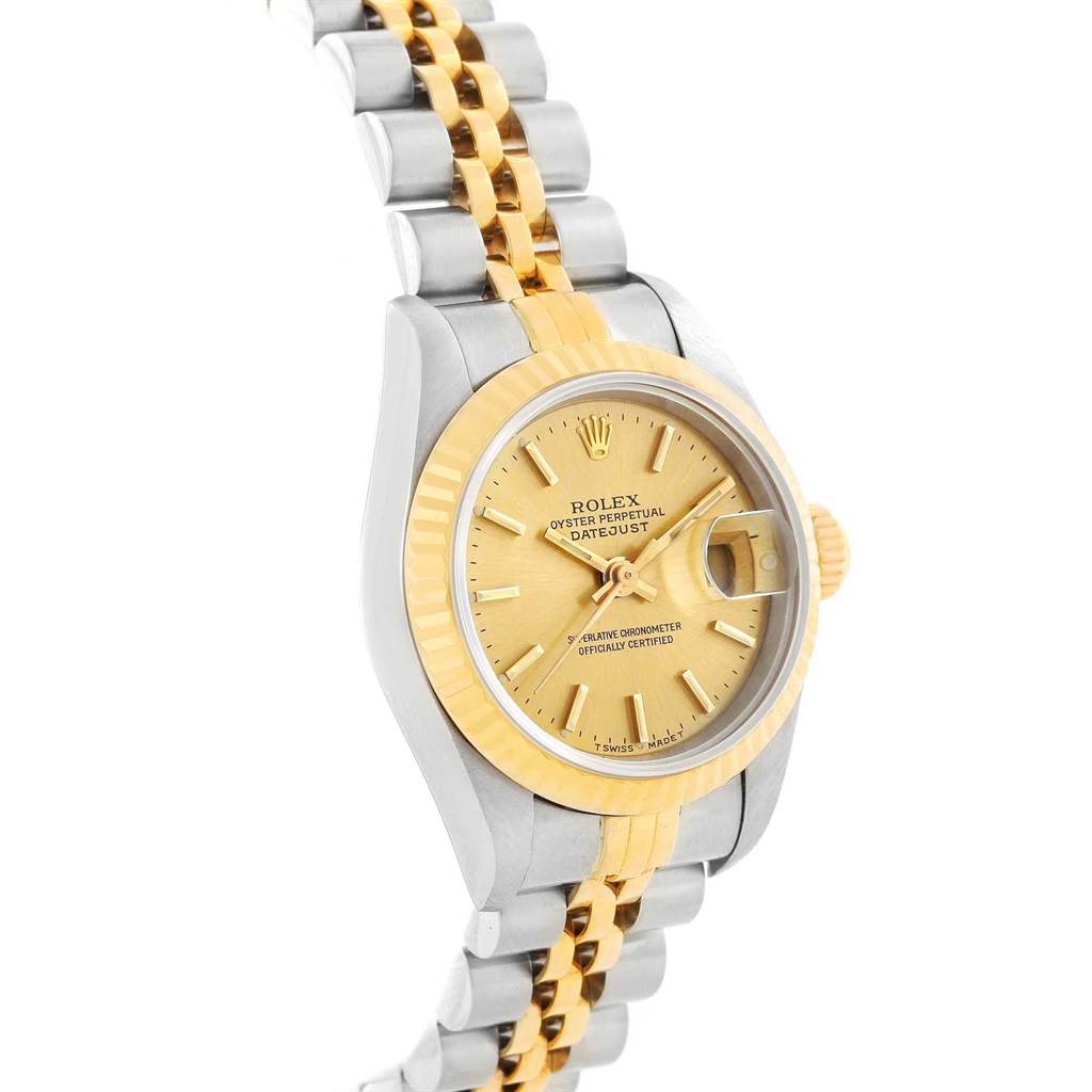 The image shows a side angle of a Rolex Datejust 79173 Women's Steel and Gold (two tone) Champagne Dial 79173 Women's Steel and Gold (two tone) Champagne Dial watch, highlighting the gold face, bezel, and two-tone bracelet.