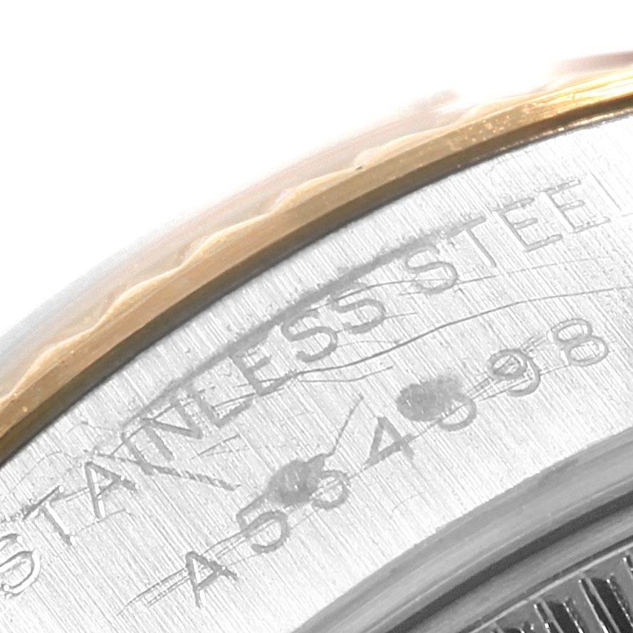 This image shows a close-up of the serial engraving and part of the case edge of a Rolex Datejust 79173 Women's Steel and Gold (two tone) Champagne Dial 79173 Women's Steel and Gold (two tone) Champagne Dial watch.
