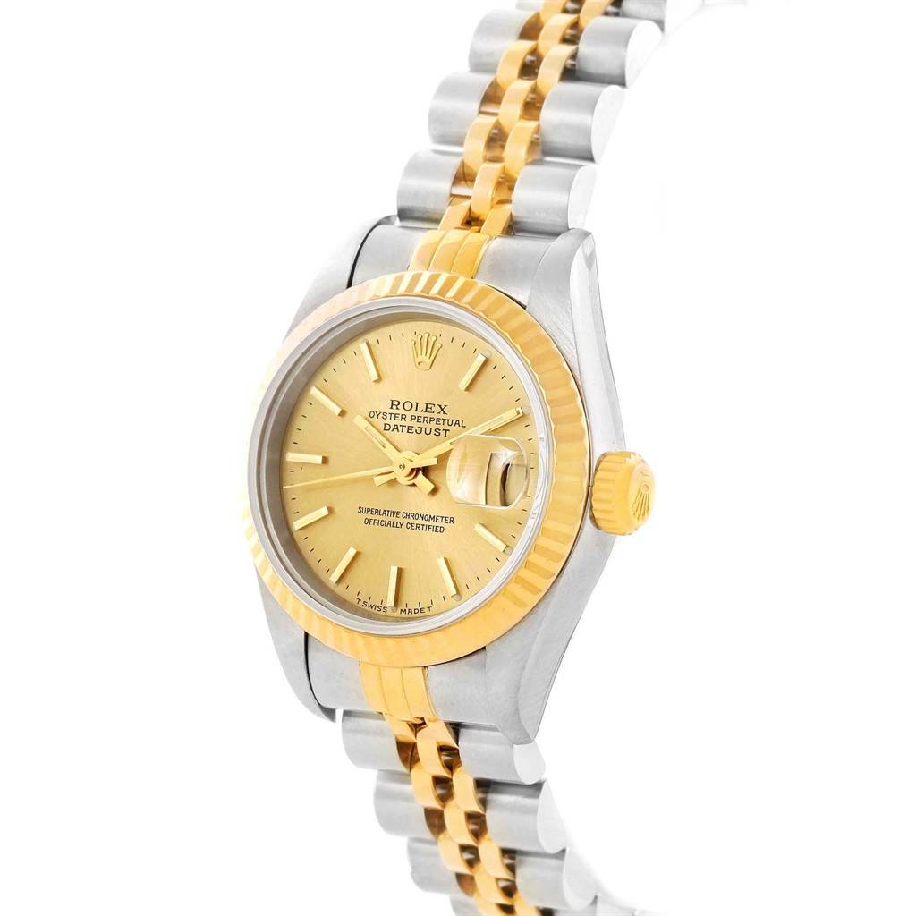 This image shows a side angle of a Rolex Datejust 79173 Women's Steel and Gold (two tone) Champagne Dial 79173 Women's Steel and Gold (two tone) Champagne Dial watch, highlighting the gold and silver bracelet, crown, and gold face.