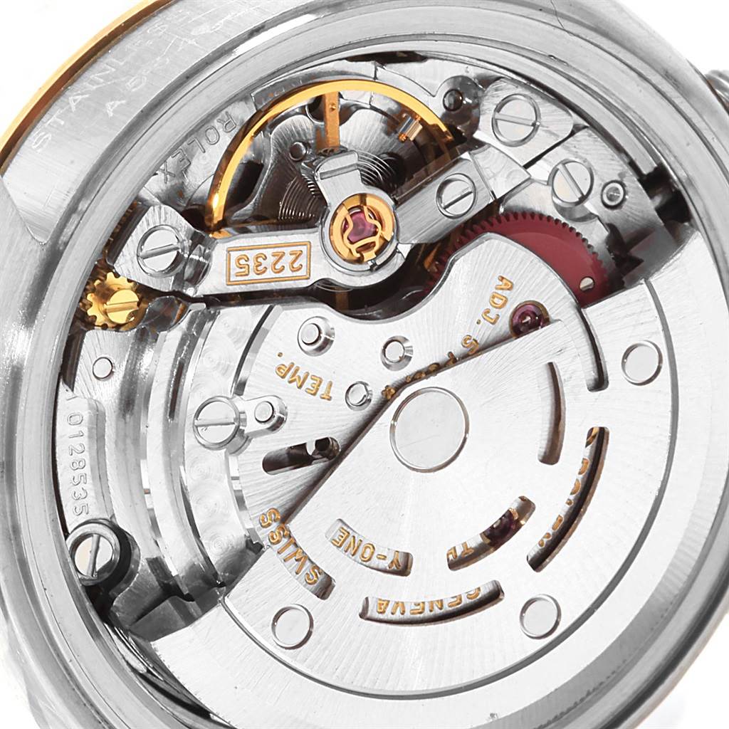 This image shows the intricate movement and inner mechanism of a Rolex Datejust 79173 Women's Steel and Gold (two tone) Champagne Dial 79173 Women's Steel and Gold (two tone) Champagne Dial watch from a close-up view.