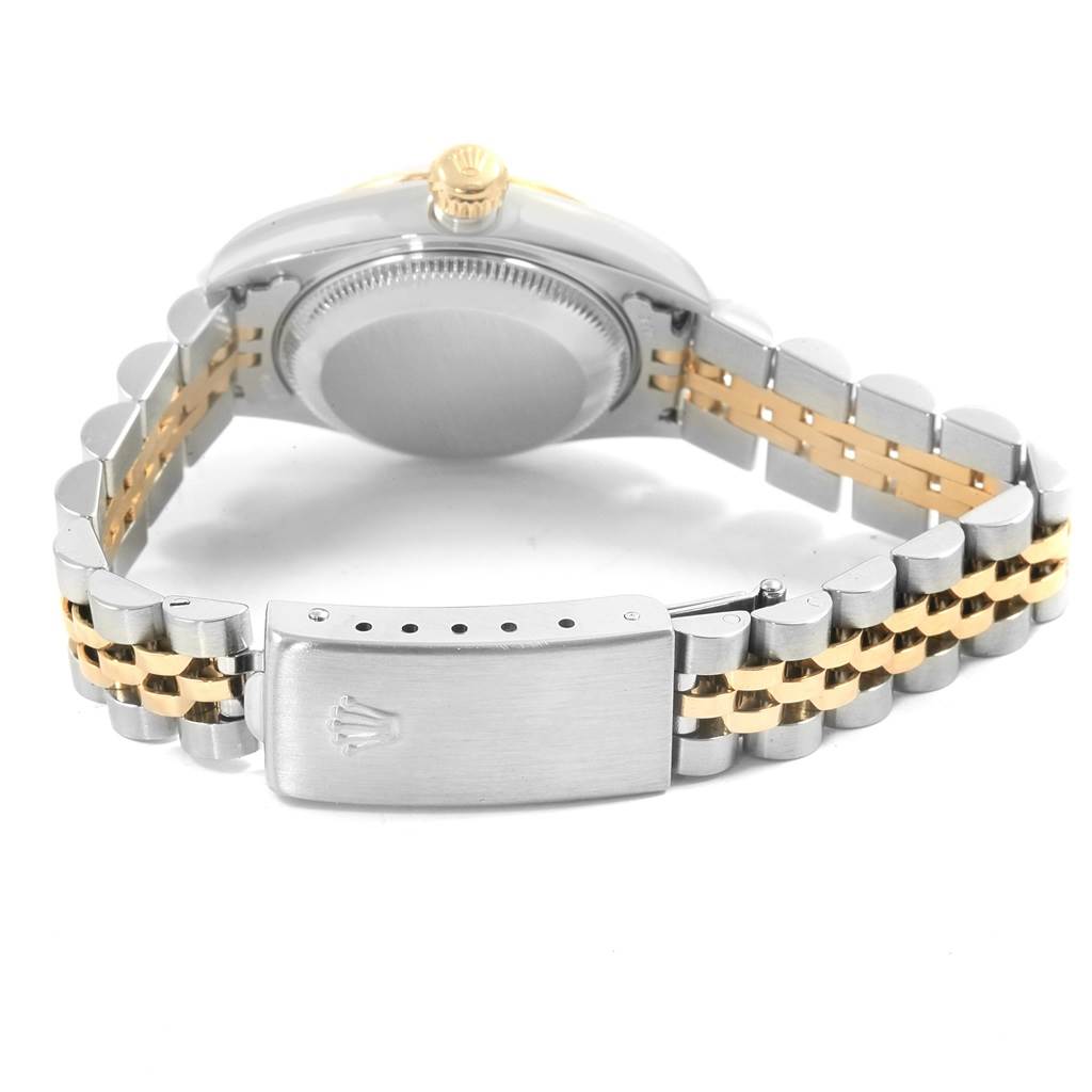 This image shows the back case and the clasp of a Rolex Datejust 79173 Women's Steel and Gold (two tone) White Dial 79173 Women's Steel and Gold (two tone) White Dial watch at an angle highlighting the stainless steel and gold bracelet.