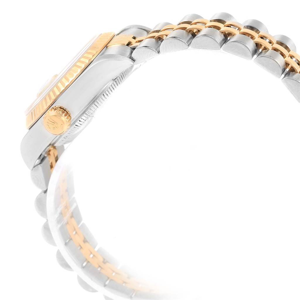 The image shows a side view of a Rolex Datejust 79173 Women's Steel and Gold (two tone) White Dial 79173 Women's Steel and Gold (two tone) White Dial watch, highlighting the crown, case, and part of the two-tone bracelet.