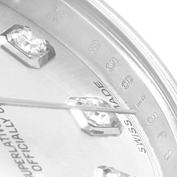 The image shows an angled close-up of the Rolex Datejust 179174 Women
s Stainless Steel Silver Dial 179174 Women
s Stainless Steel Silver Dial watch face, highlighting the diamond markers and "Swiss Made" text.