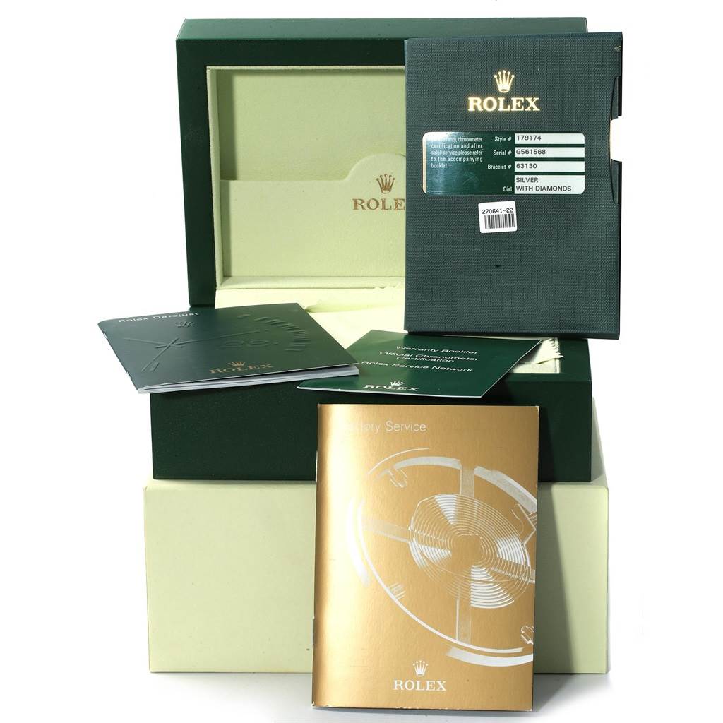 The image shows the packaging and accessories for a Rolex Datejust 179174 Women
s Stainless Steel Silver Dial 179174 Women
s Stainless Steel Silver Dial watch, including the box and various manuals.