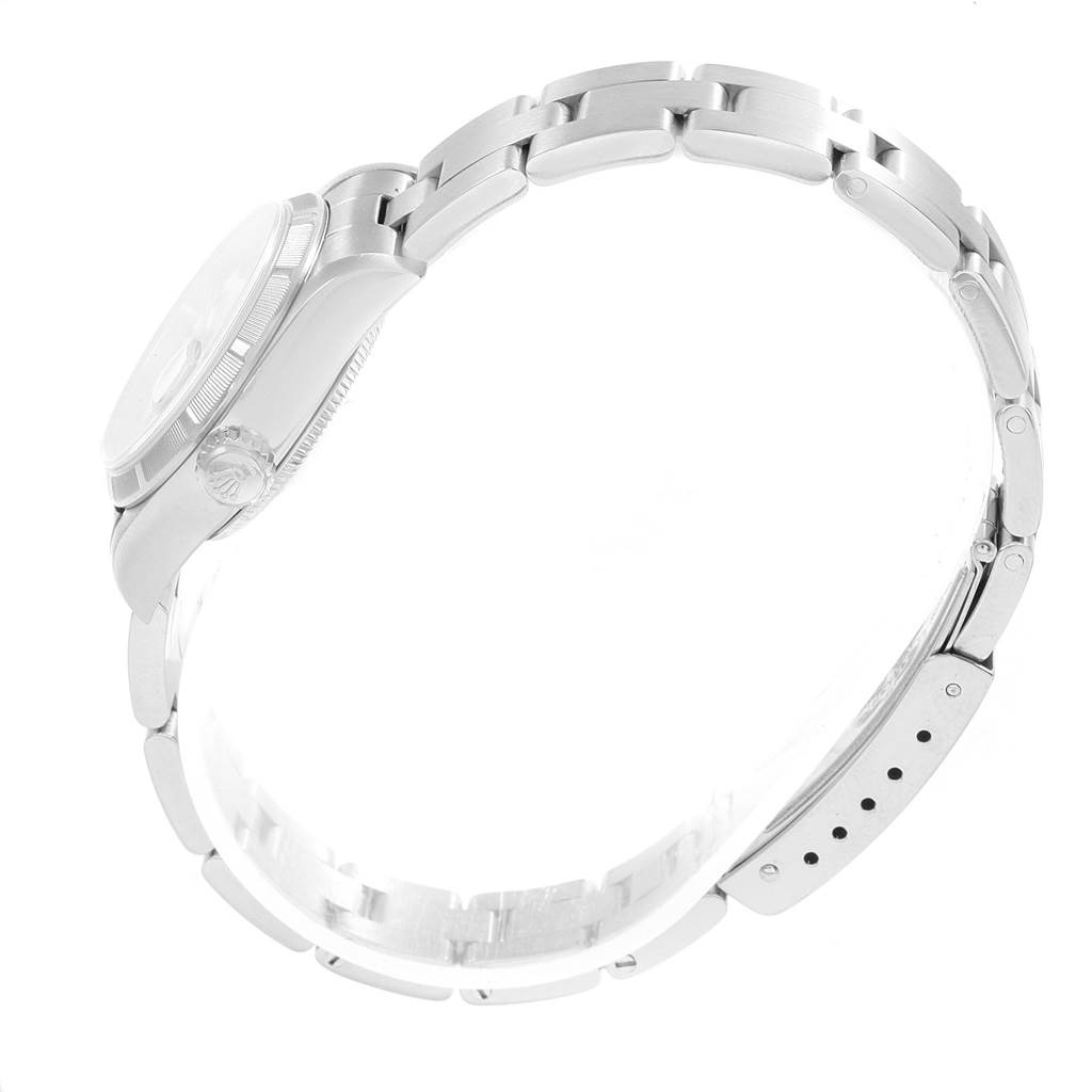 The image shows a side view of a Rolex Datejust 79190 Women's Stainless Steel White Dial 79190 Women's Stainless Steel White Dial watch focusing on its bracelet and the side of the watch case with the crown.