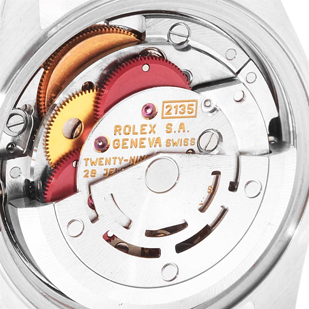 The image shows a close-up of the movement of a Rolex Datejust 69173 Women
s Stainless Steel Silver Dial 69173 Women
s Stainless Steel Silver Dial watch, focusing on the gears and inner mechanism.