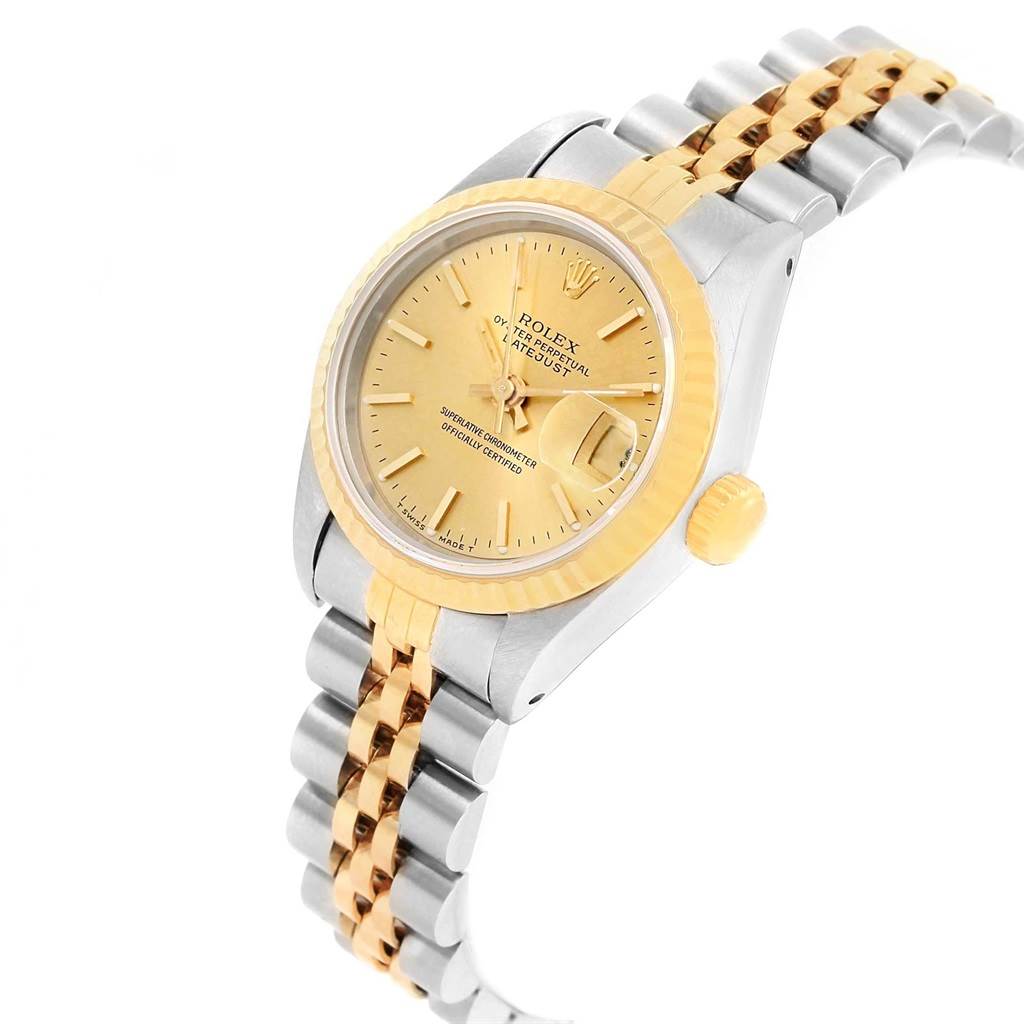 The image shows a side and front angle of a Rolex Datejust 69173 Women's Stainless Steel Champagne Dial 69173 Women's Stainless Steel Champagne Dial watch, featuring a gold bezel, champagne dial, and two-tone bracelet.