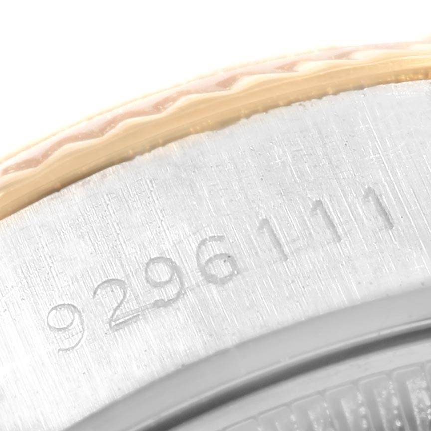 This close-up image shows the serial number engraving on the side of a Rolex Datejust 69173 Women's Stainless Steel Champagne Dial 69173 Women's Stainless Steel Champagne Dial watch case.
