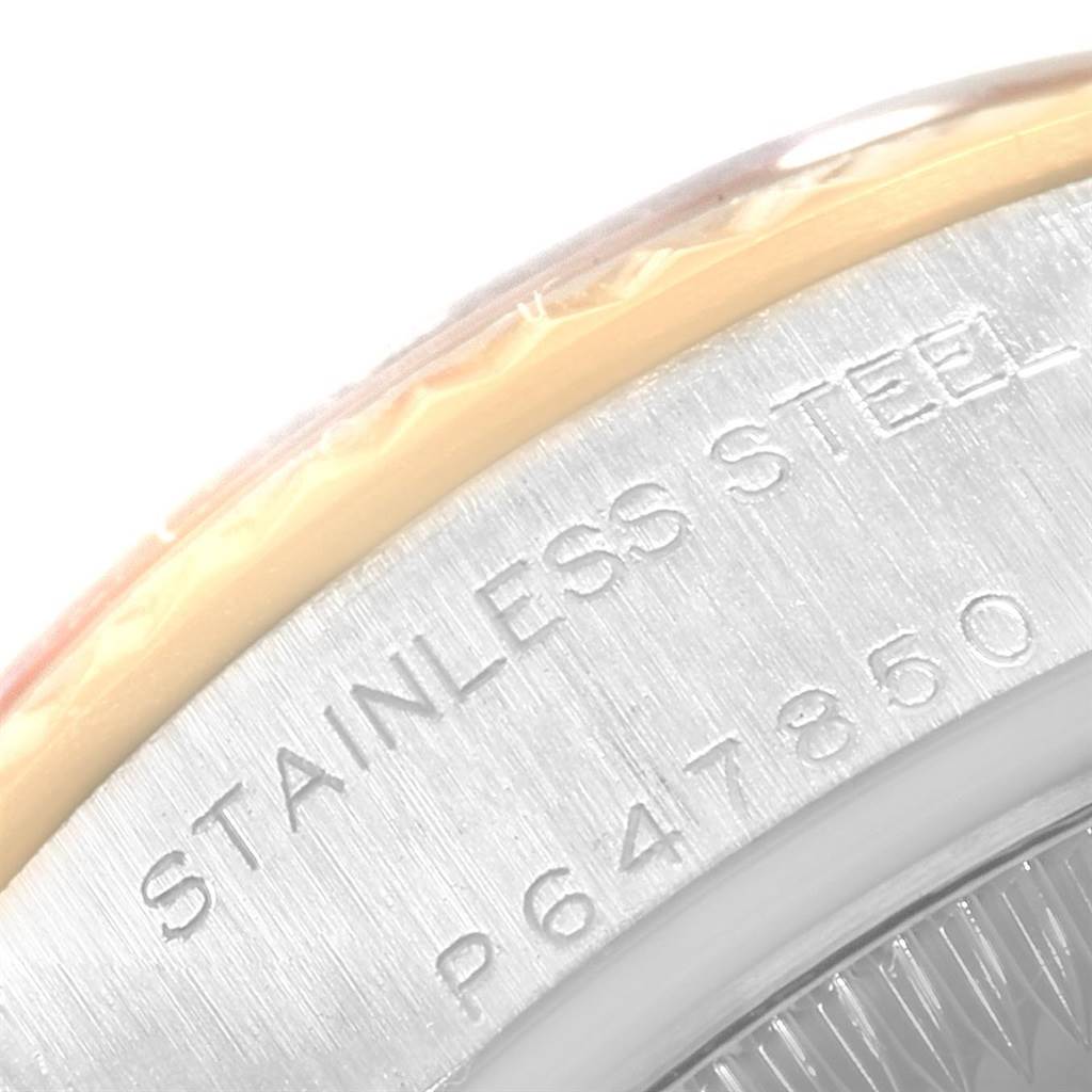 This image shows a close-up of the case back edge, highlighting the "STAINLESS STEEL" engraving of a Rolex Datejust 79173 Women's Steel and Gold (two tone) Grey Dial 79173 Women's Steel and Gold (two tone) Grey Dial watch.