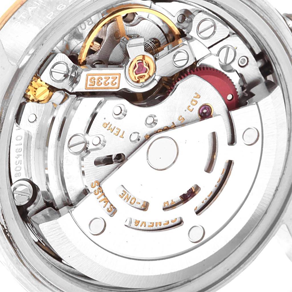 This image shows an inside view of the Rolex Datejust 79173 Women's Steel and Gold (two tone) Grey Dial 79173 Women's Steel and Gold (two tone) Grey Dial watch, specifically the movement and inner mechanisms.