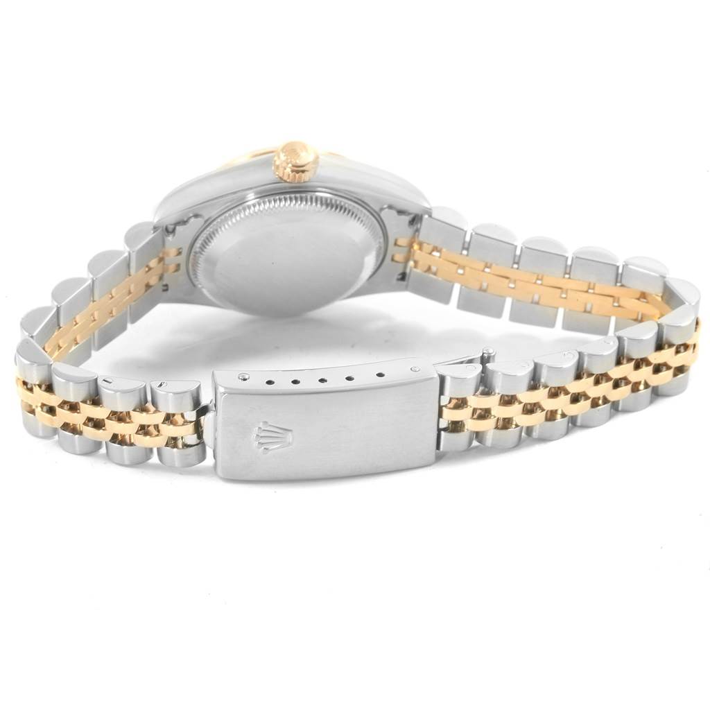 This Rolex Datejust 79173 Women's Steel and Gold (two tone) Grey Dial 79173 Women's Steel and Gold (two tone) Grey Dial model is shown from the back, highlighting the clasp, bracelet, case back, and crown.