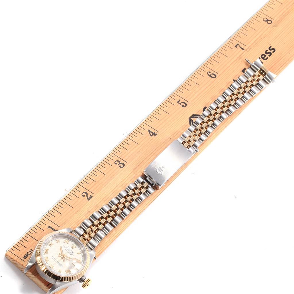 The Rolex Datejust 69173 Women's Stainless Steel Beige Dial 69173 Women's Stainless Steel Beige Dial watch is shown from a top-down angle, highlighting the face, bracelet, and clasp.