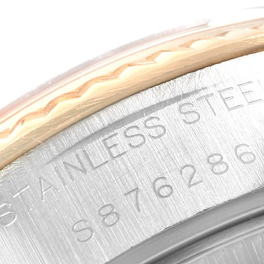 The image shows a close-up angle of the serial number and the "STAINLESS STEEL" engraving on the case back of a Rolex Datejust 69173 Women's Stainless Steel Beige Dial 69173 Women's Stainless Steel Beige Dial watch.