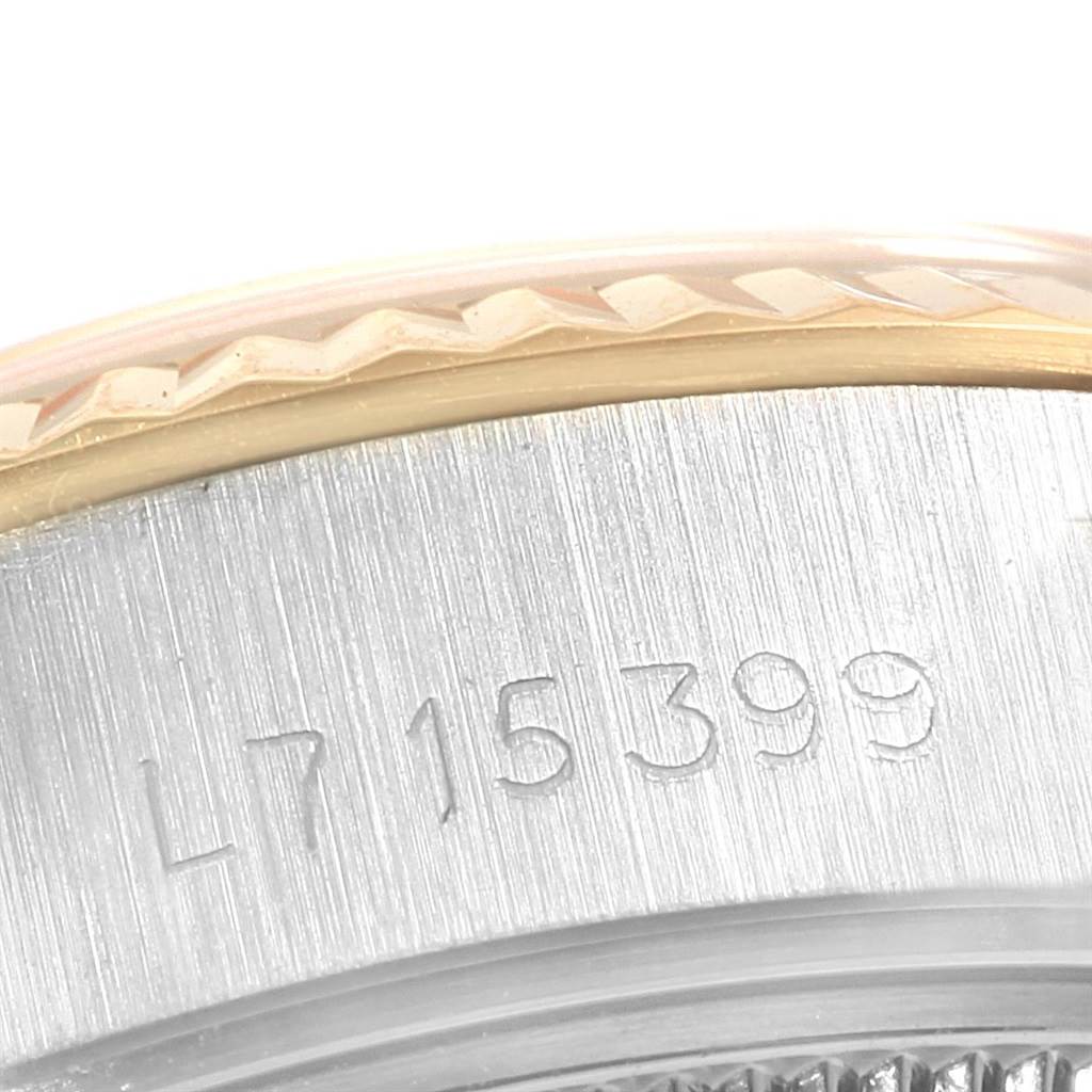 The image shows a close-up of the Rolex Datejust 69173 Women's Stainless Steel Silver Dial 69173 Women's Stainless Steel Silver Dial watch's case side, with the reference number "L715399" engraved.