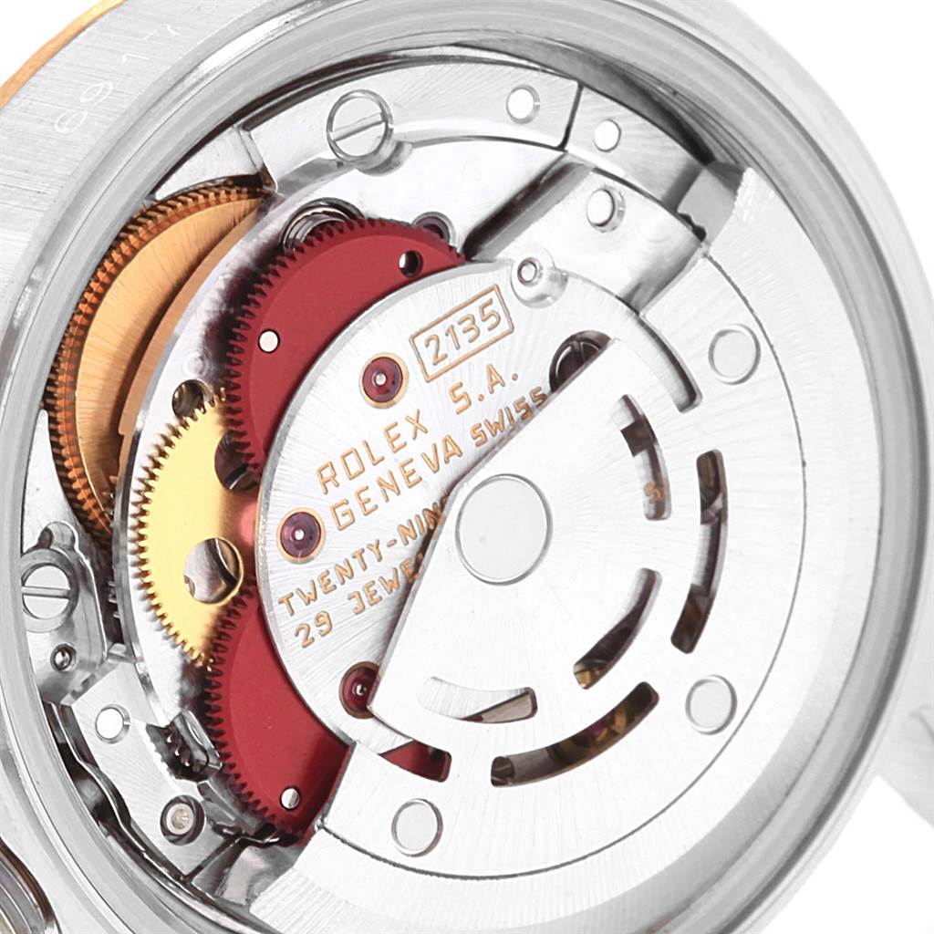 The image shows a close-up view of the Rolex Datejust 69173 Women's Stainless Steel Silver Dial 69173 Women's Stainless Steel Silver Dial watch movement, highlighting the gears and internal mechanisms.
