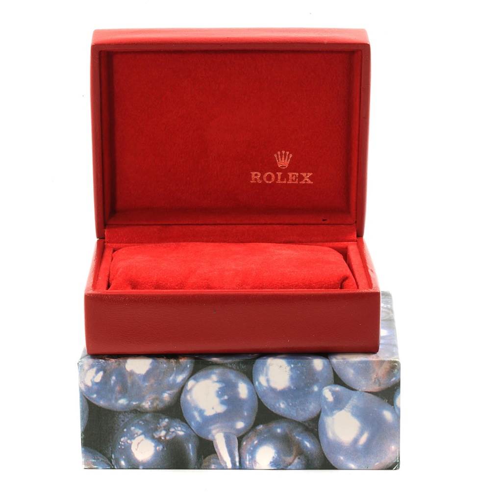 The image shows an open Rolex Datejust 69173 Women's Stainless Steel Silver Dial 69173 Women's Stainless Steel Silver Dial watch box, displaying its red cushioned interior and the Rolex logo inside the lid.