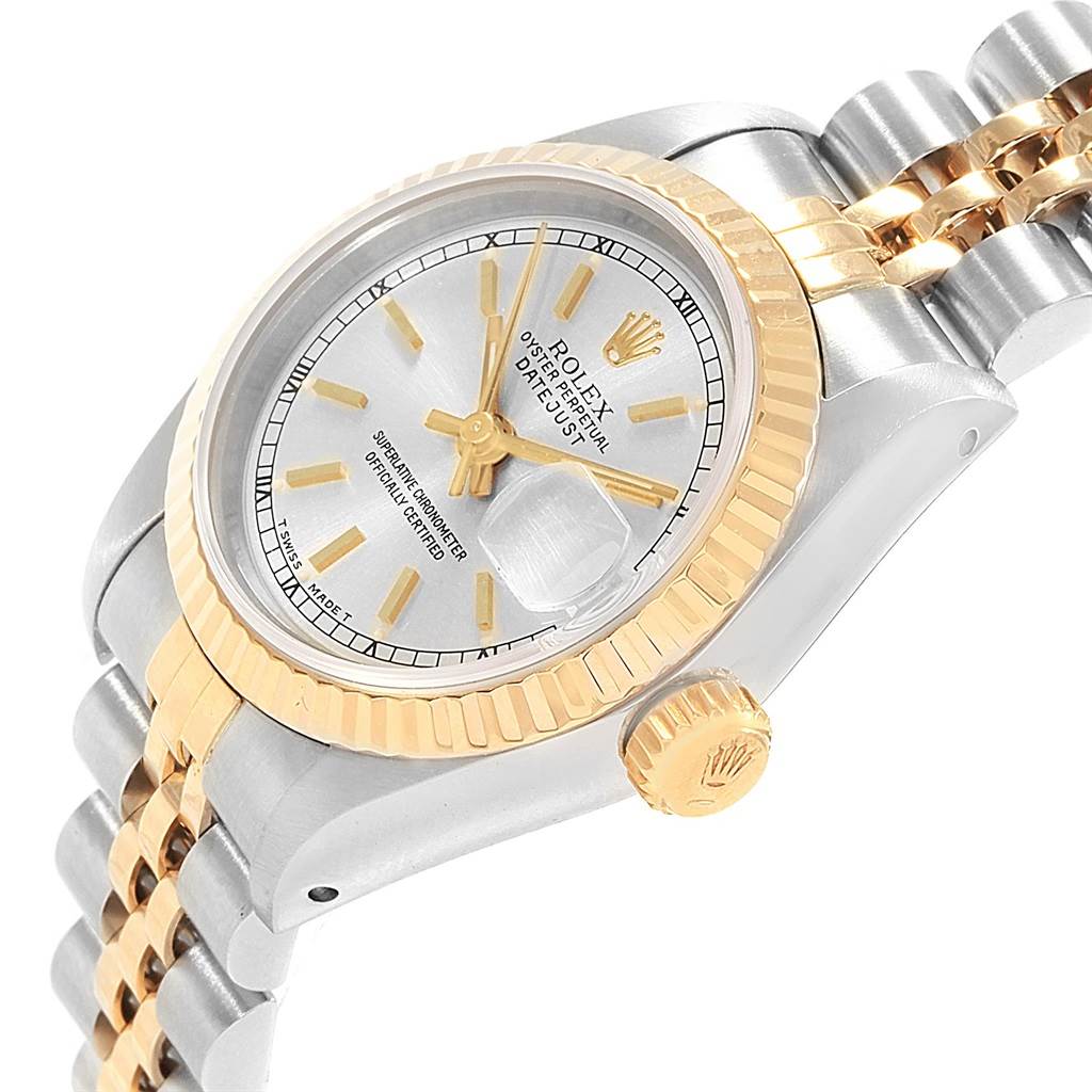 The Rolex Datejust 69173 Women's Stainless Steel Silver Dial 69173 Women's Stainless Steel Silver Dial watch is shown from an angled side view, highlighting the dial, fluted bezel, and two-tone bracelet.