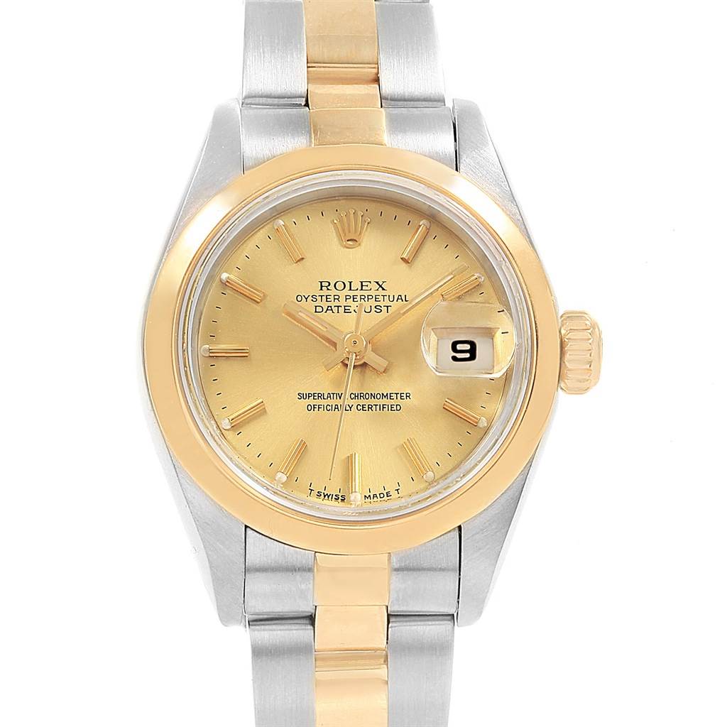 The Rolex Datejust 69163 Women's Stainless Steel Champagne Dial 69163 Women's Stainless Steel Champagne Dial watch is shown from a top-down angle, highlighting its gold dial, bezel, and bi-tone metal bracelet.