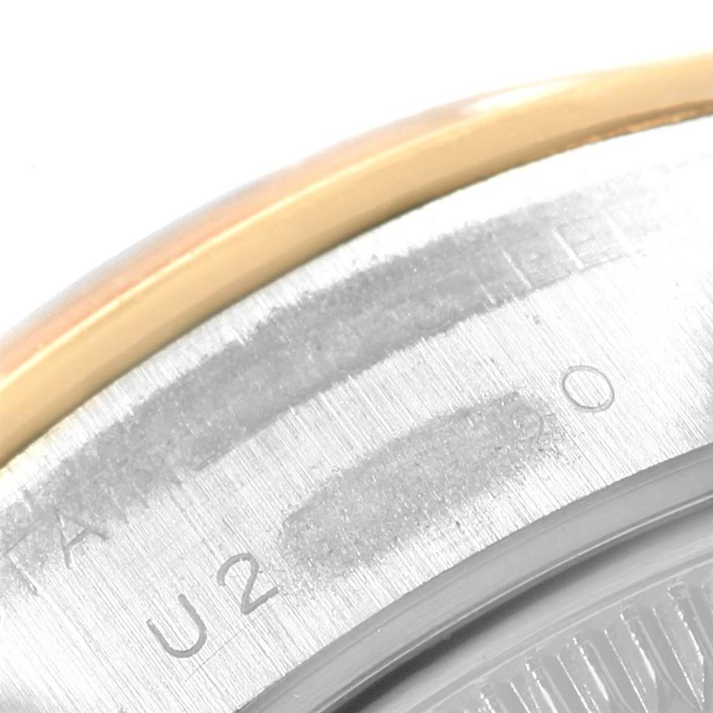 This close-up image shows part of the bezel and case back of a Rolex Datejust 69163 Women's Stainless Steel Champagne Dial 69163 Women's Stainless Steel Champagne Dial watch.