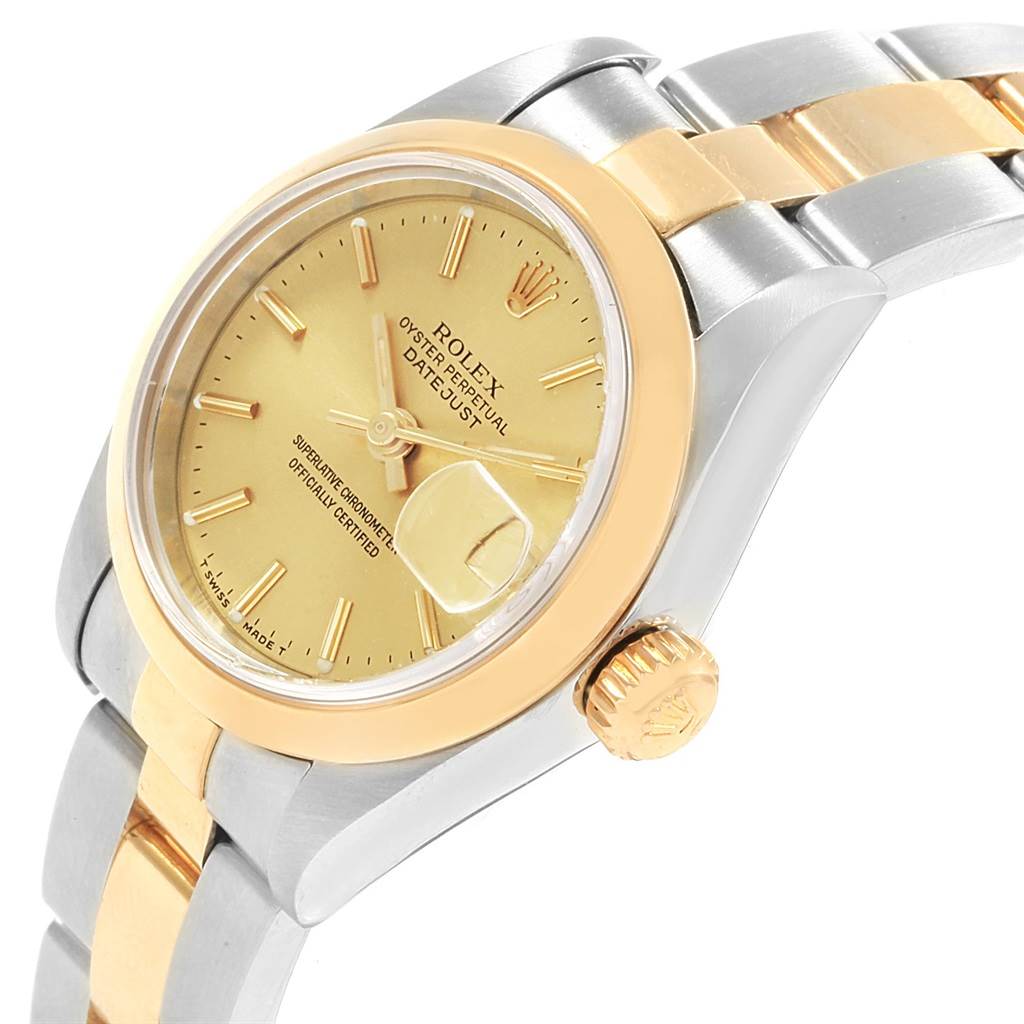 The image shows a Rolex Datejust 69163 Women's Stainless Steel Champagne Dial 69163 Women's Stainless Steel Champagne Dial watch at a tilted angle, highlighting its gold bezel, crown, and two-tone bracelet.